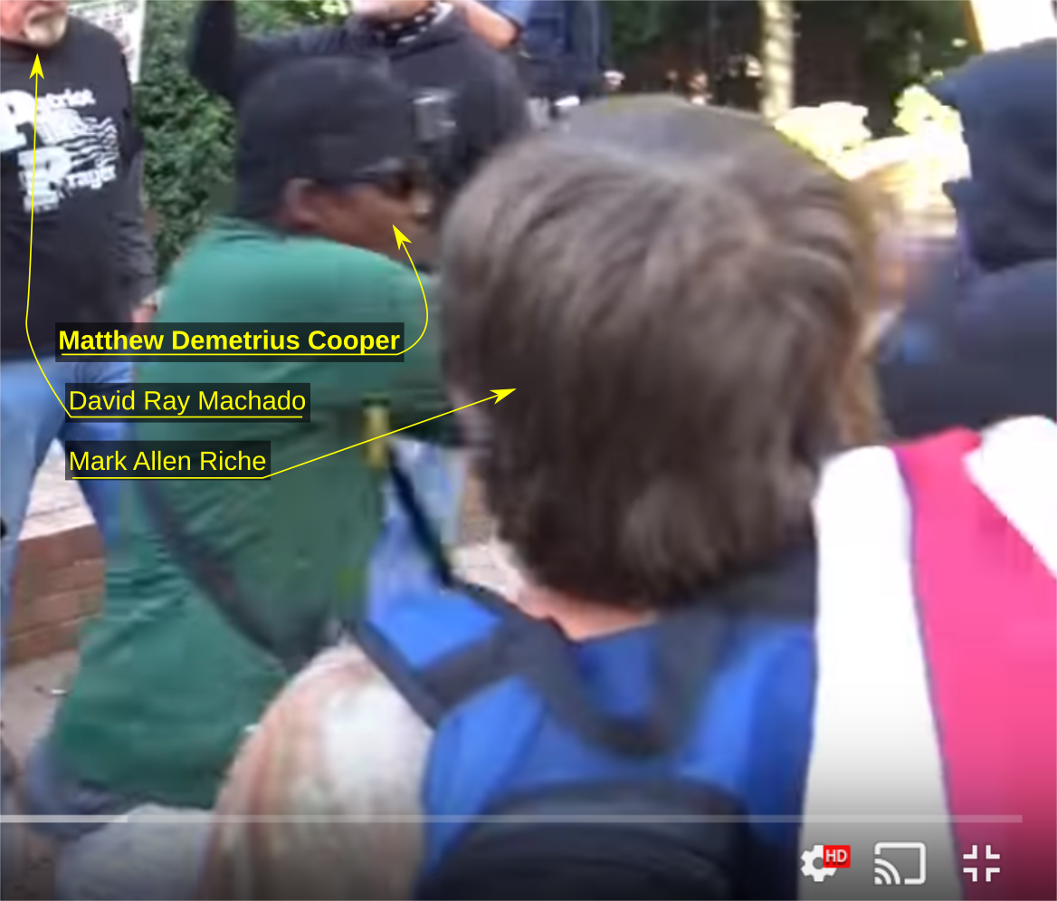 Deme Cooper shoves an anti-fascist activist down concrete stairs at an October 8 Patriot Prayer rally in Portland OR