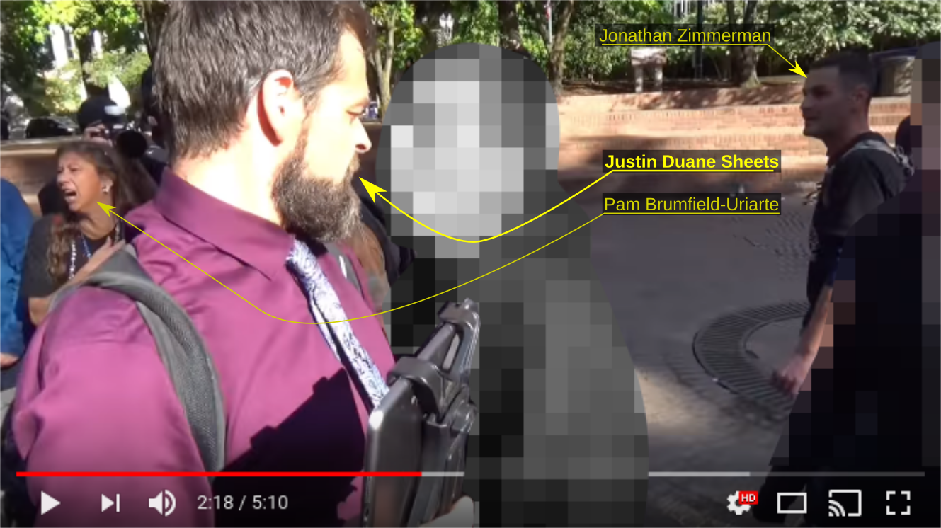 Justin Sheets shoves an anti-fascist protester at an October 8, 2017 Patriot Prayer rally in Portland OR