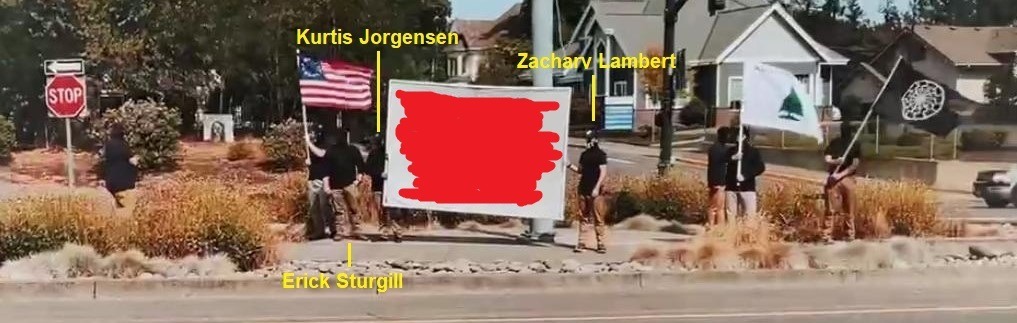 Picture of RCN members standing on a traffic island with fascist flags; Kurtis Jorgensen, Zachary Lambert, and Erick are labeled