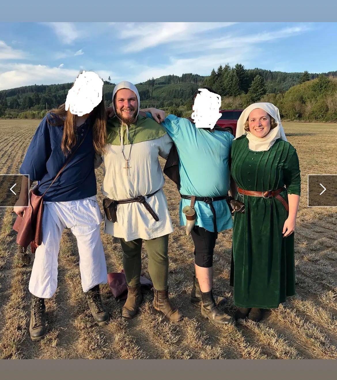 Picture of Erick and Samantha with two other people who's faces are redacted; they are all wearing old-timey costumes while they stand in what appears to be a farm field