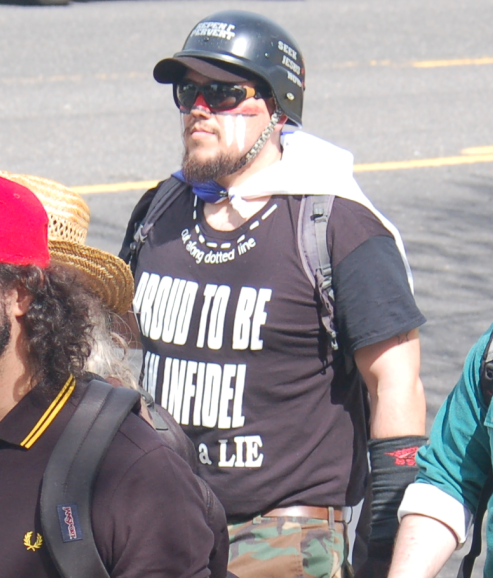 Michael Pena displays an Islamophobic slogan on his shirt