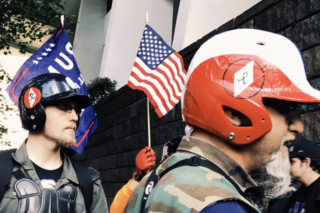 Two rally participants sport the NSM Odal Rune at Patriot Prayer’s 6/4 rally in downtown Portland.