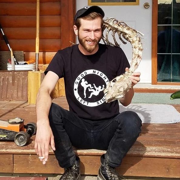 Jeffery Hughes wearing a fascist 'good night left side' shirt