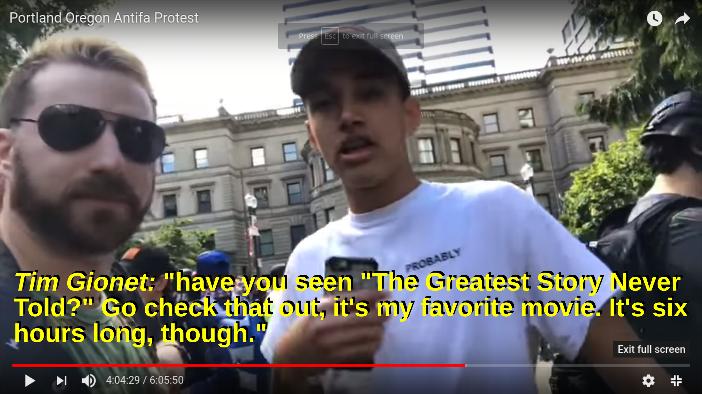 a racist expresses affection for hitler to a young person at a patriot prayer rally