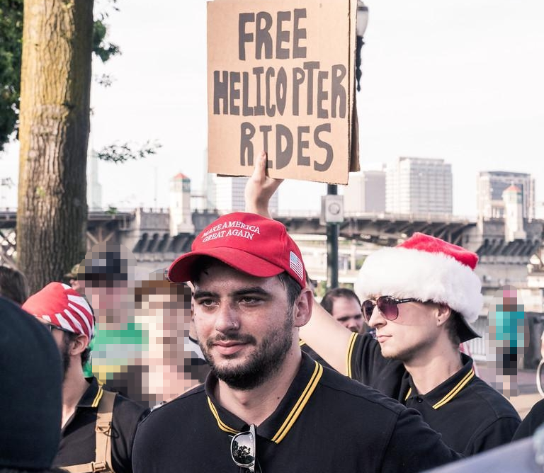 Anthony Bell with free helicopter rides sign