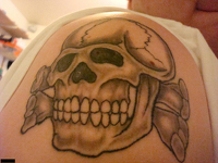 Second image showing another one of Chase&rsquo;s tattoos, in this case a neo-Nazi totenkopf symbol. 
